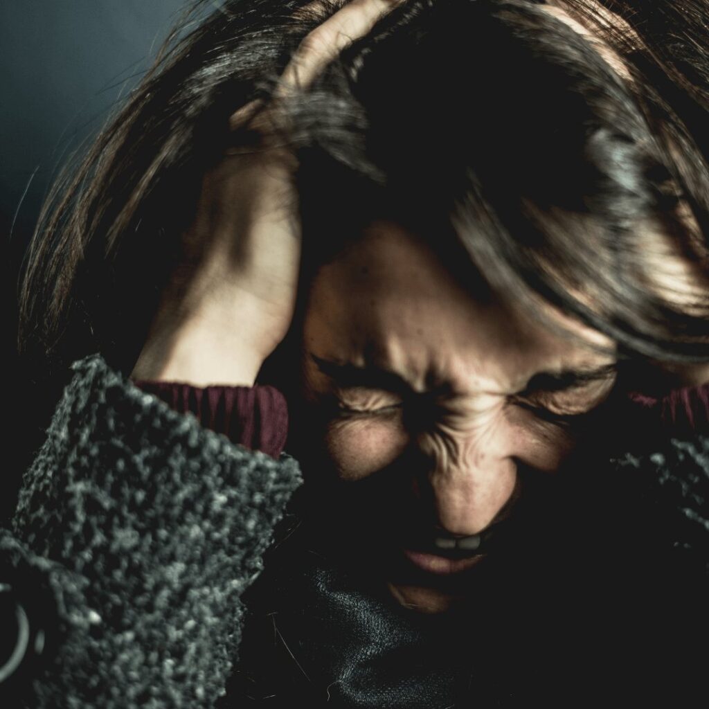 A girl suffering from headache and thinking if meth is addiction