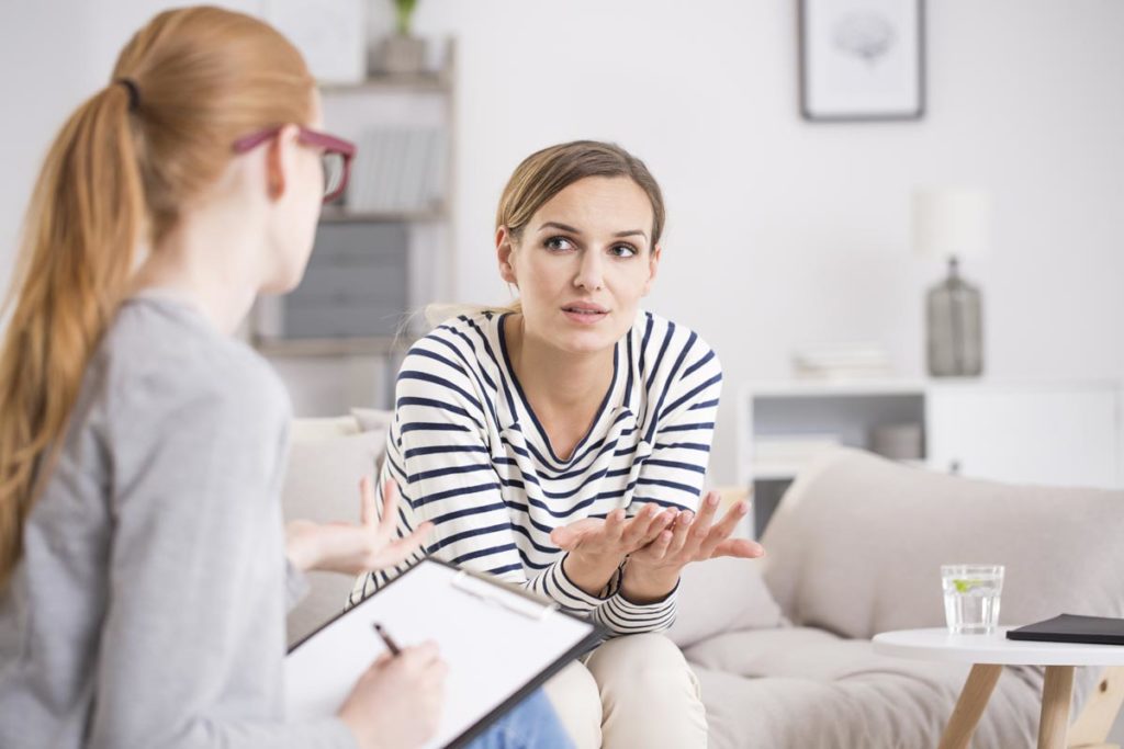Asana-Recovery-I’m-Scared-to-Go-to-Rehab---Am-I-Weird-photo-of-a-woman-consulting-with-a-support-specialist