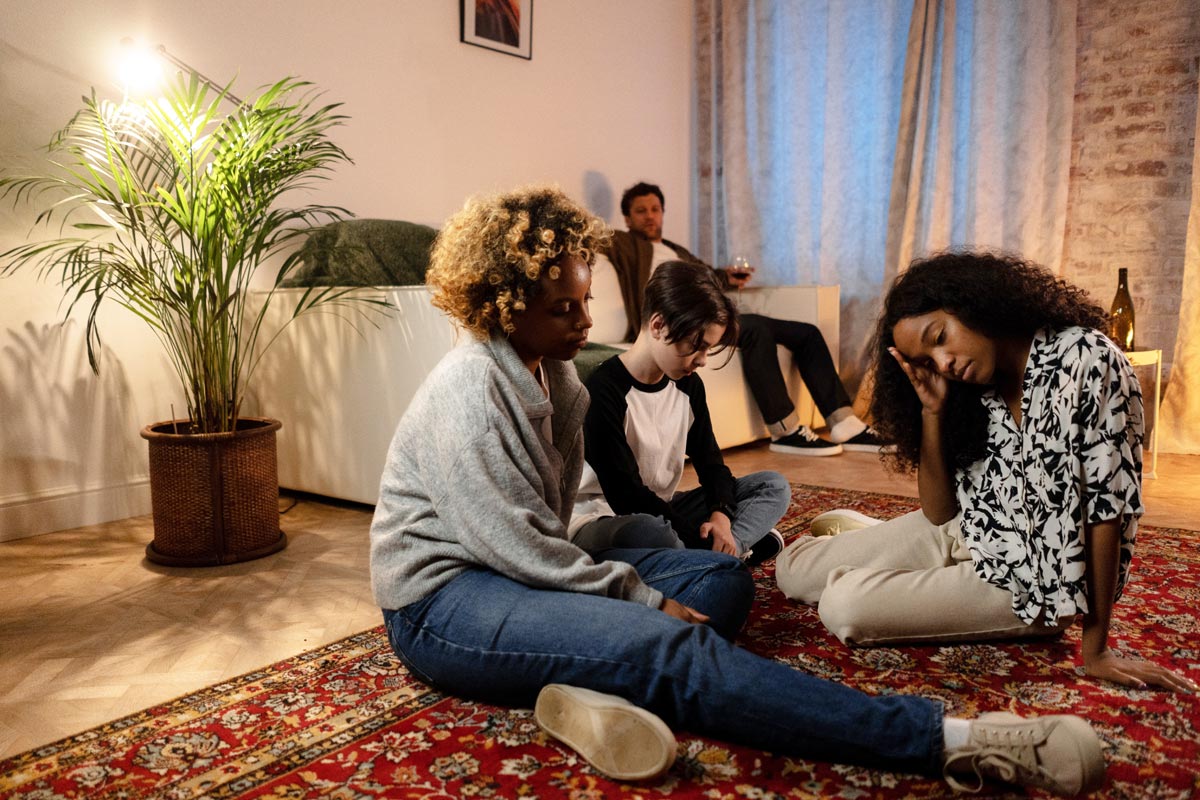 a father drinking alcohol with his kids around