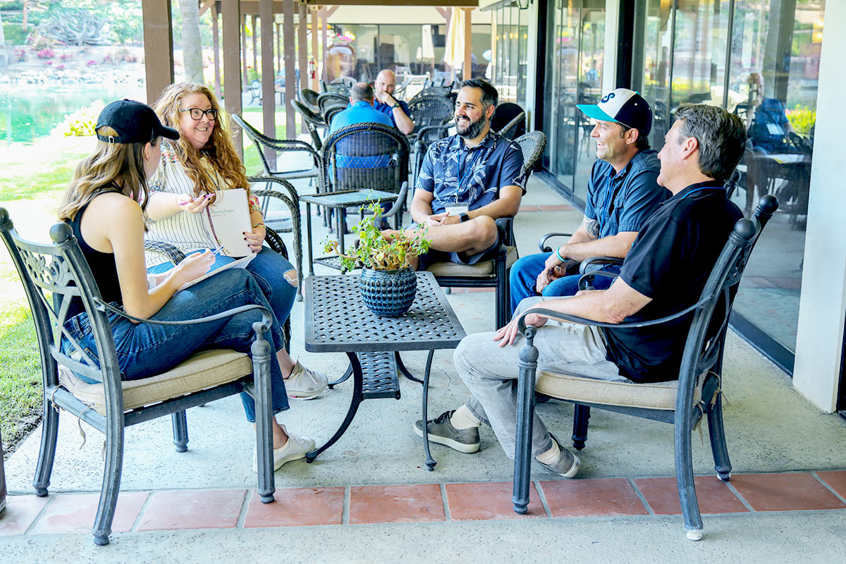 group of alumni in addiction treatment center learning together