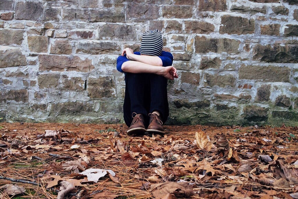 young man alone and lonely social isolation concept