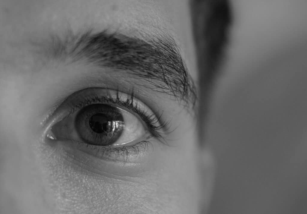 A young man has his pupils dilated due to heavy cocaine usage; and needs treatment here at Asana Recovery.
