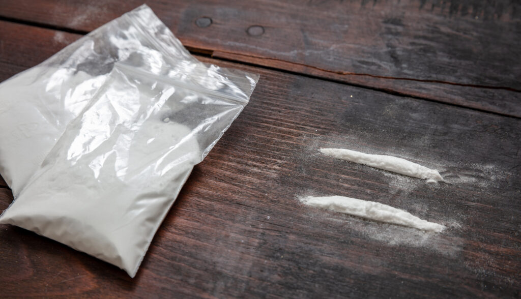 2 cocaine lines; this substance is highly addictive; call us if you're struggling with this substance.