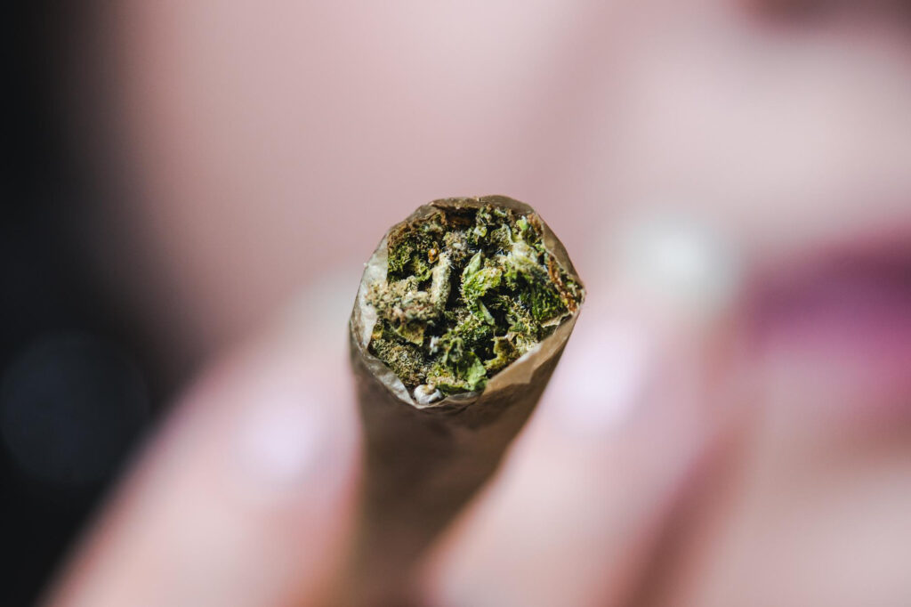 A marijuana cigarette being lit; will increase the days needed to be completely clean.