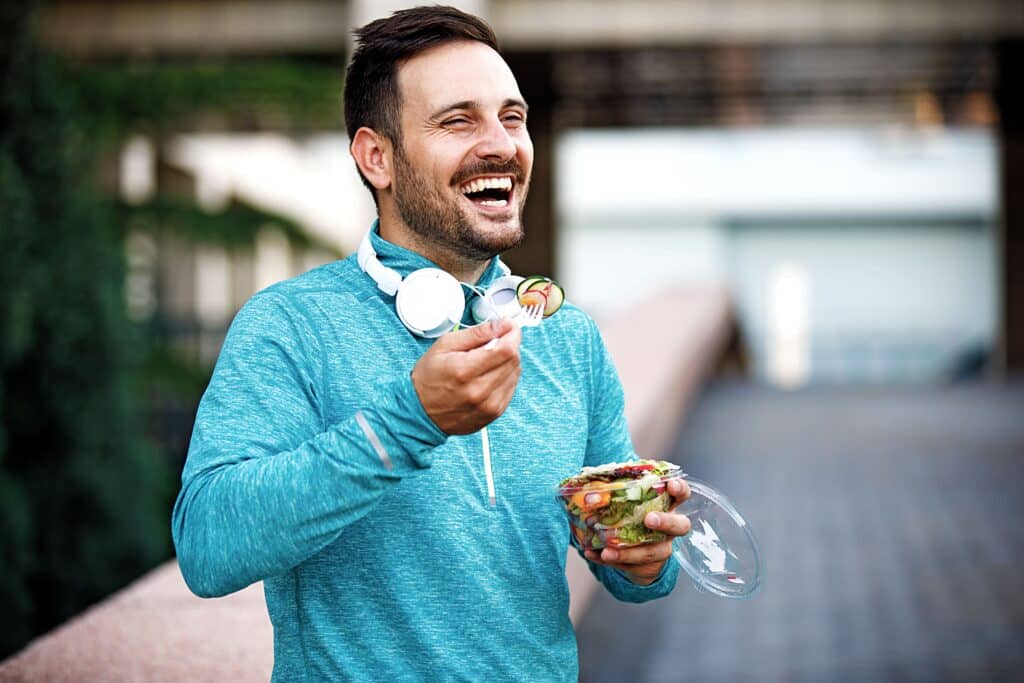 A young man eating salad several days before a key drug test.