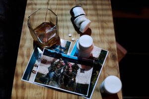 How do I detox off alcohol?-above-angle-of-wooden-table-with-bottles-with-pill-2023-11-27-05-21-11-utc (1).jpg