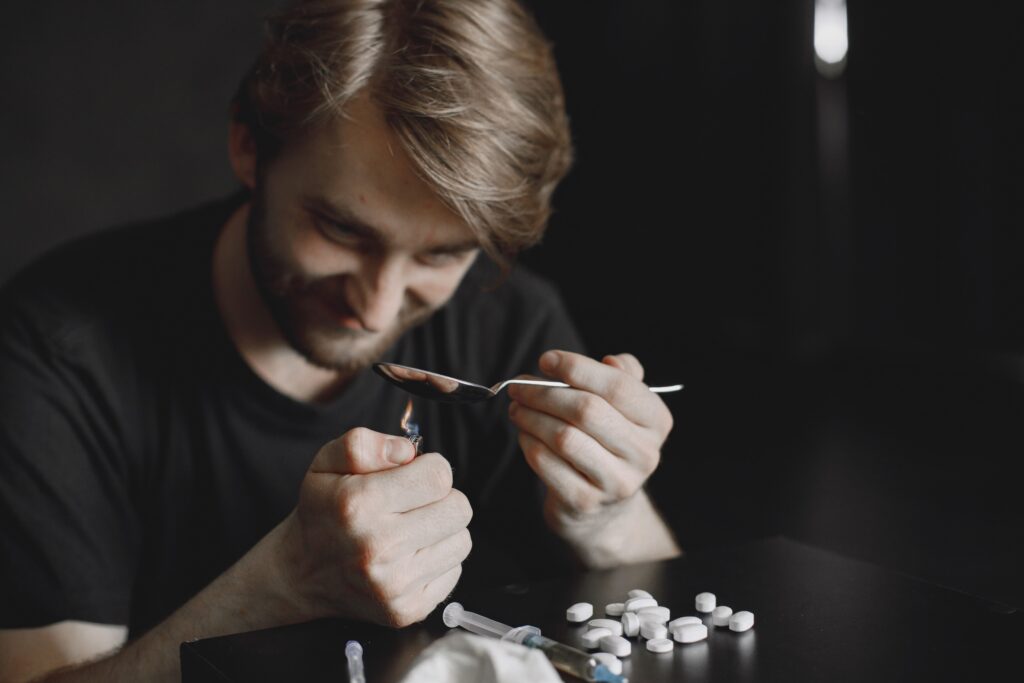 Feining: Understanding the Slang, Signs, and Connection-addict-preparing-drug-dose-for-injection-in-dark-r-2024-12-07-00-45-27-utc (1).jpg