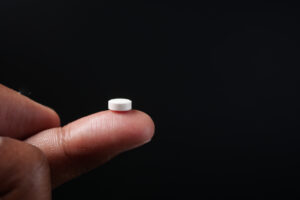 Is there a possibility that phenibut will be banned in the future?-closeup-of-a-medical-tablet-on-a-finger-on-black-b-2024-12-12-02-41-17-utc.jpg