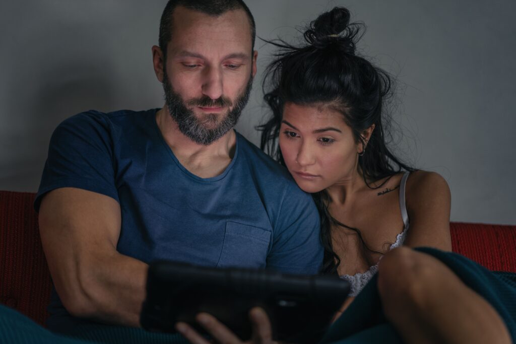 Withdrawal From Porn Addiction-hipster-couple-using-digital-tablet-on-sofa-2024-07-01-19-25-13-utc (1).jpg
