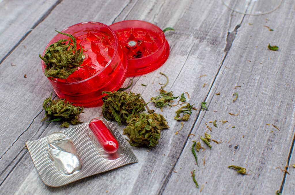 Can You Smoke Weed on Ibuprofen?-marijuana-buds-a-grinder-and-a-pill-medical-marij-2023-11-27-05-28-57-utc.jpg