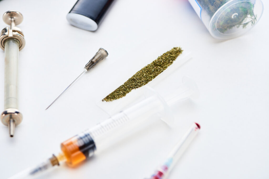 HHC Cannabinoid: What You Need To Know-selective-focus-of-syringes-near-rolling-paper-wit-2024-11-09-15-02-22-utc.jpg