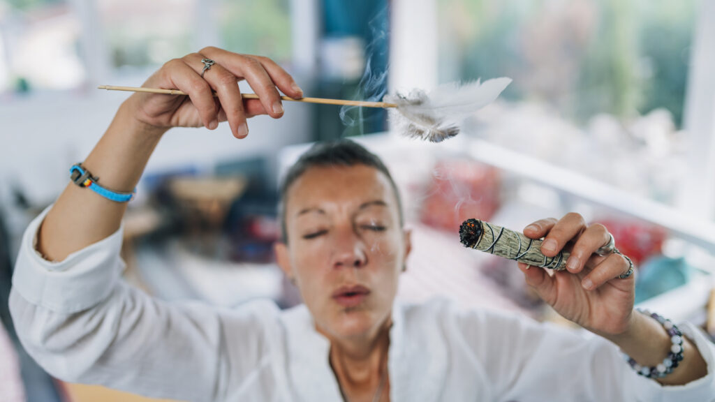 Pros and Cons of Natural Highs-smudging-or-space-cleansing-with-sage-for-removal-2024-10-18-08-44-55-utc.jpg