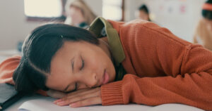 What helps ease withdrawal symptoms?-tired-nap-and-student-on-desk-in-classroom-at-sch-2024-10-14-22-59-50-utc.jpg