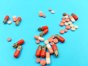 What category of drugs does adderall fall under?-view-of-different-pills-and-tablets-on-the-blue-ba-2023-11-27-05-36-51-utc.jpg