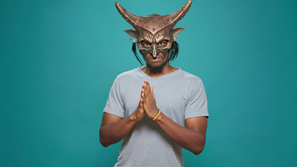 Demon Face Syndrome-young-man-wearing-ancient-tribal-mask-with-sacral-2023-11-27-05-11-55-utc.JPG