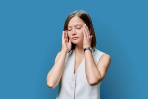 How long do phenibut withdrawals last reddit?-young-woman-experiencing-stress-headache-on-blue-2024-12-08-04-33-48-utc (1).jpg